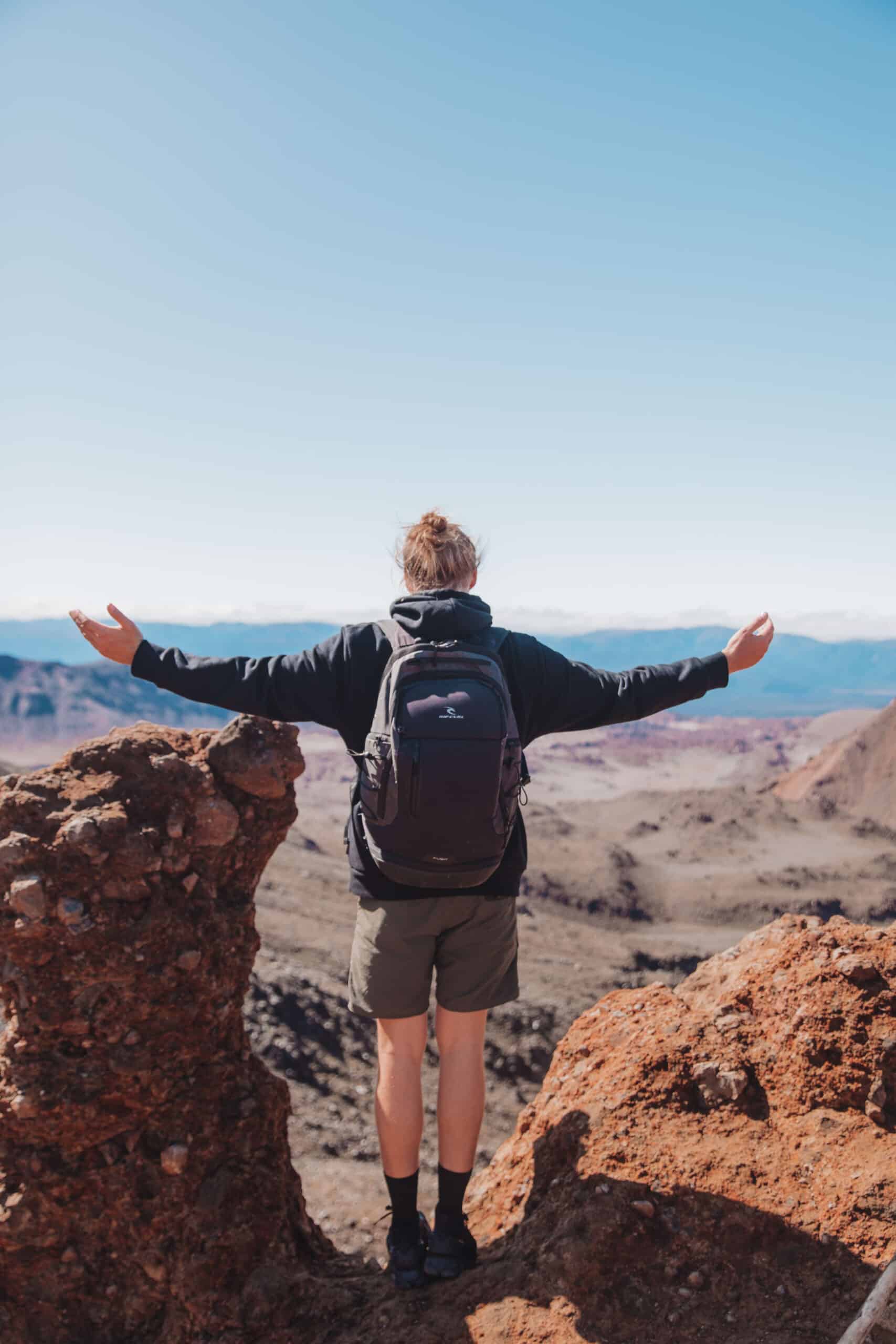 backpacker travelling around queenstown with a backpack and the view.